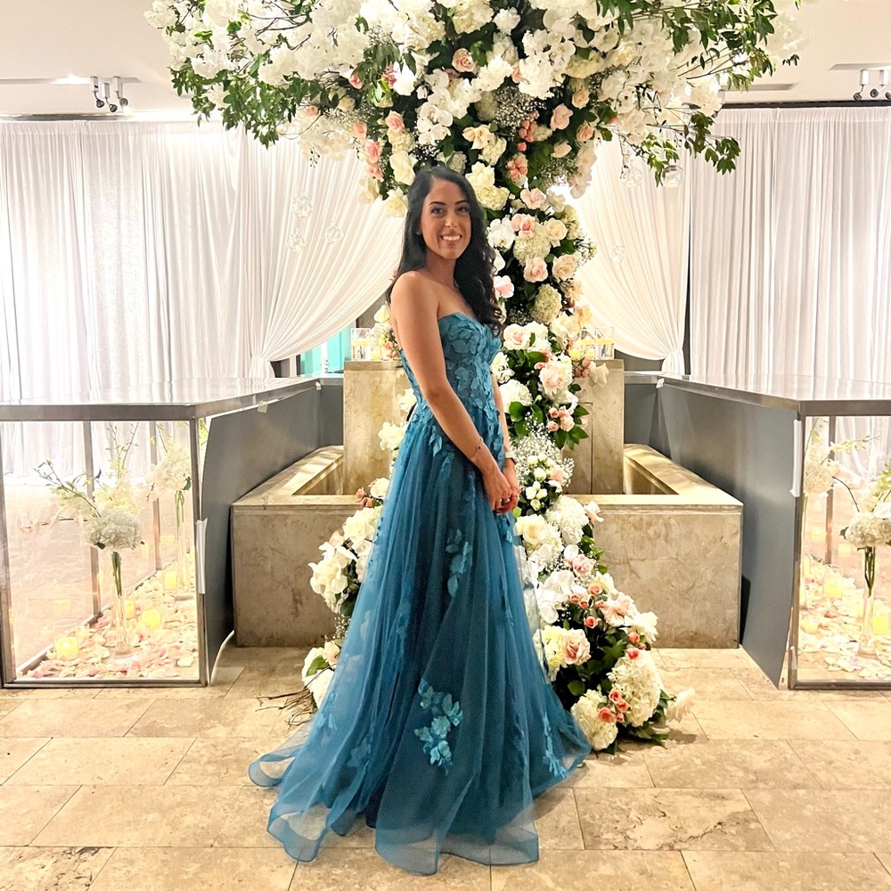 Elegant Blue Strapless Gown with Floral Details